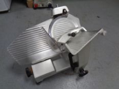 A commercial meat slicer