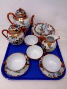 A tray of fifteen piece Japanese egg shell tea service