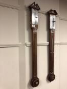An inlaid mahogany stick barometer with silver dial