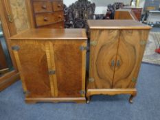 Two audio cabinets in a walnut finish
