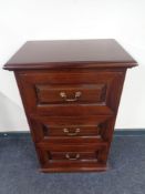 A Victorian style three drawer chest with brass drop handles