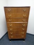 A 20th century teak G-Plan E Gomme seven drawer chest