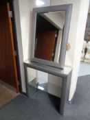 A contemporary mirrored hall table with undershelf and matching bevelled mirror