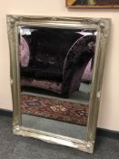 A silvered framed contemporary mirror 3' x 2 '