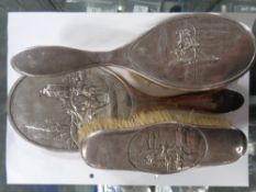 A three piece silver backed dressing table brush and hand mirror set,