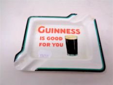 A Guinness china ashtray 