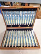 An Edwardian canteen of silver plated cutlery, retailed by A.S.