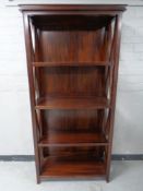 A mahogany effect open bookcase