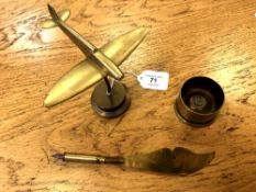 A trench art plane paperweight, an ashtray and a letter knife.