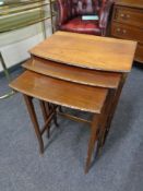 A nest of three Edwardian mahogany tables