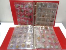 Two albums of world coins