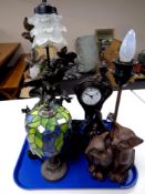 A tray of three contemporary Tiffany style and figural style table lamps,