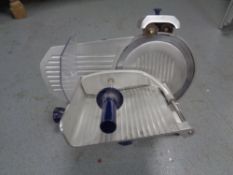 A commercial meat slicer