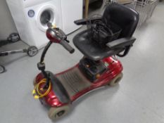 A Shop Rider mobility cart with key and charger