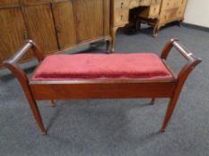 An Edwardian storage duet piano stool