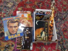 A box containing 40 x 30 inch rolled cinema posters, vintage calendars to include Marilyn Monroe,