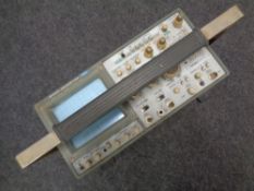 A Hitachi oscilloscope V-1100A.