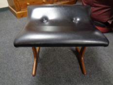 A mid century teak and black vinyl dressing table stool