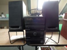 A Pioneer four piece separates hifi system with pair of speakers on stand