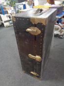 An early 20th century metal bound shipping trunk