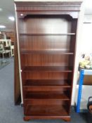 A set of mahogany open bookshelves