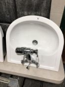 A Vogue wall mounted sink with mixer tap