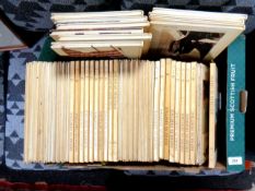 A box containing American Heritage volumes.