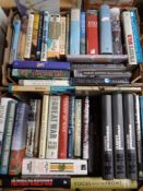 Two boxes containing hardback volumes relating to War, novels by Terry Pratchett.