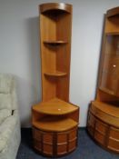 A twentieth century antique Nathan corner stand fitted cupboards beneath.