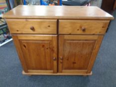 A pine double door sideboard