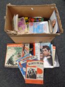 A box of sheet music and music books