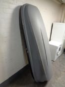 A Halfords car roof box with key