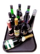 A tray of alcohol, Harvey's Bristol Cream, Veuve champagne,