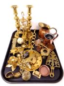 A tray of brass and copper ware, pair of brass candlesticks, miniature companion set, trivet,