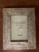 Three crates containing a total of 63 Xenos Fotolijst silvered-finish wooden photo frames,