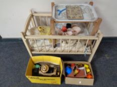 A vintage painted doll's cot together with doll's clothing and tea ware