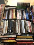 Two boxes containing hardback volumes, novels to include Kathy Reichs,