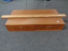 A mid-twentieth century wall-mounted shelf fitted two drawers.