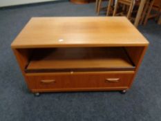 A 20th century G-plan TV stand fitted with a drawer