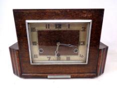 An Art Deco oak mantel clock