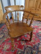 An Edwardian elm and beech smoker's chair