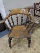 An Edwardian elm and beech smoker's armchair