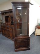 A Jaycee furniture carved oak corner unit