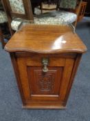 A 19th century carved oak fall fronted coal receiver with liner and brass fittings