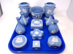 A tray of Wedgwood blue and white Jasperware including lidded trinket pots,