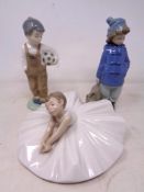 Two Nao figures of boys together with further ballerina figure
