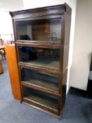 An Edwardian oak four tier stacking bookcase