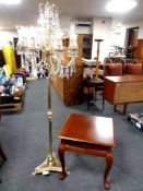 An occasional table on cabriole legs in mahogany finish together with a decorative brass eight way