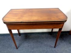 A 19th century inlaid mahogany tea table