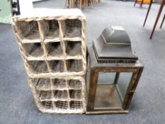 A wood and metal candle lantern together with two wicker wine baskets